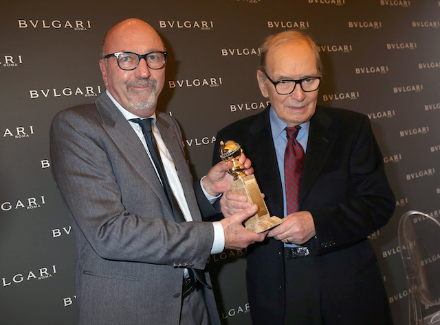 Italian composer Ennio Morricone receives Golden Globe for Best Original Score for Quentin Tarantino's hit movie 'The Hateful Eight from Lorenzo Soria, President of the Hollywood Foreign Press Association at the Golden Globes Ceremony Honoring Ennio Morricone hosted by BVLGARI at Bulgari DOMVS on January 30, 2016 in Rome, Italy.  (Photo by Elisabetta Villa/Getty Images for BVLGARI)